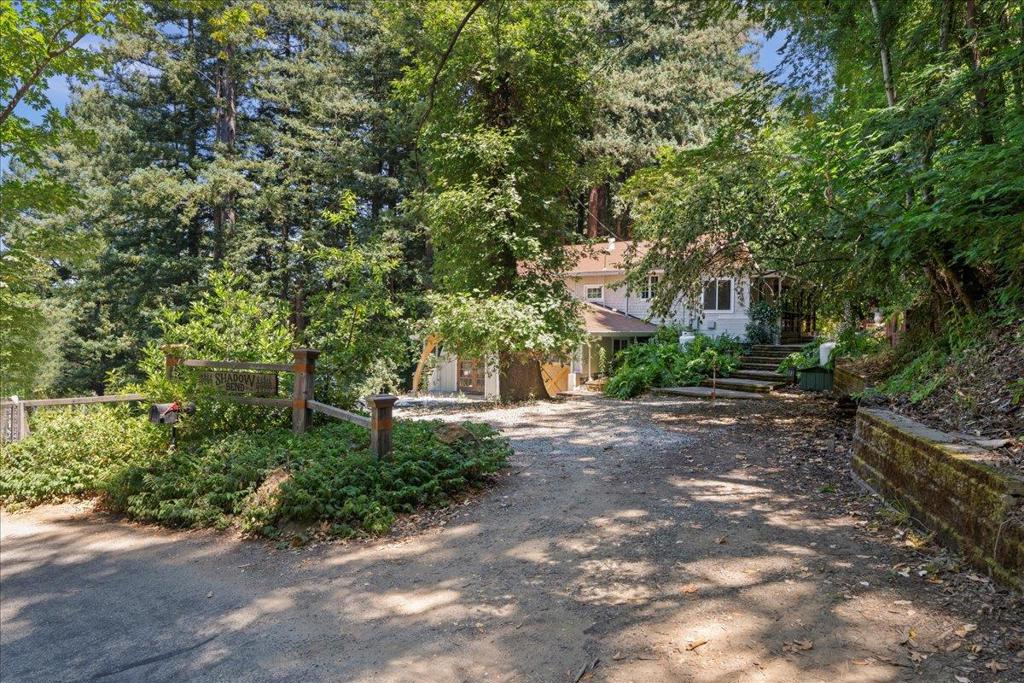 Fixer-Upper opportunity in an ideal Los Gatos mountain location. Contractor special, just minutes from downtown Los Gatos. The home requires an engineered retaining wall and a new engineered septic system due to a slide. The spacious kitchen includes a separate breakfast room, and the large living room features a cozy wood stove. The upper level offers two generous bedrooms and a full bathroom. The lower level includes a family room, game room, full bathroom, two additional sizable bedrooms, a laundry area, and abundant storage. Enjoy the hardscaped patio and award-winning Los Gatos Schools.