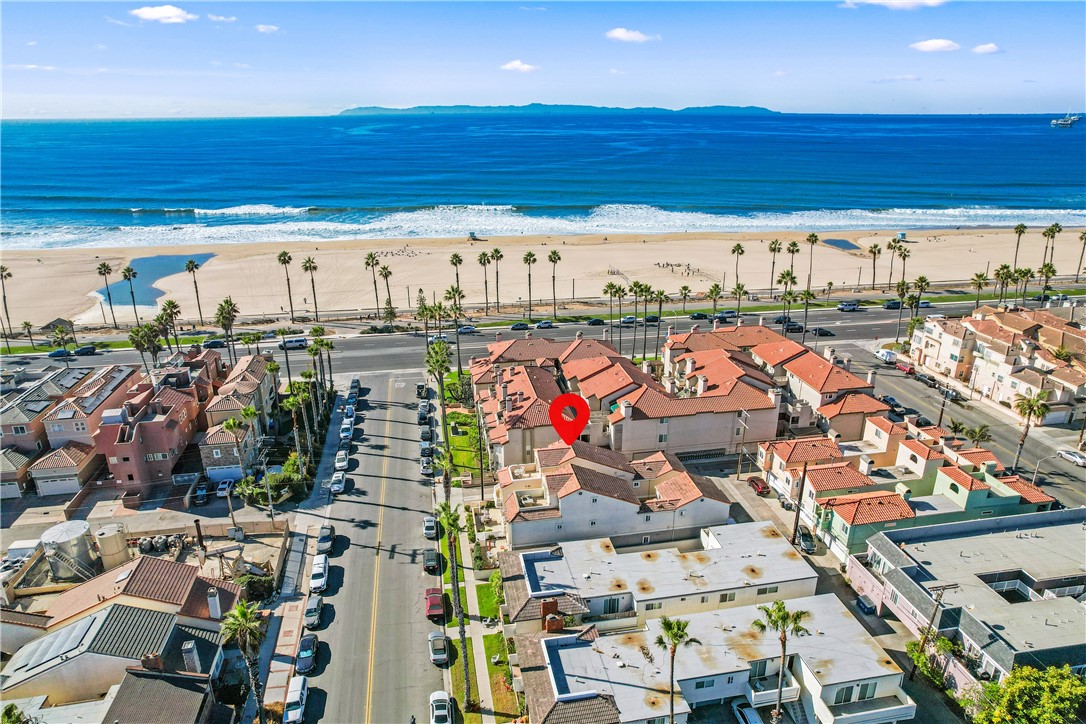 Welcome to your dream beach house in Huntington Beach, where the rhythm of the ocean and the laid-back, surf-town vibe define everyday life. Just steps from the beach, this stunning 3-bedroom, 2.5-bath home invites you to experience coastal living at its finest. With sea, sand and shoreline views as well as a view of Catalina Island from every floor, this is more than just a place to live—it's a lifestyle. Imagine waking up to the sound of waves crashing on the shore and the scent of saltwater filling the air. Open your eyes, step onto your wrap around balcony, and take in the beauty of the Pacific stretching out before you. A cool ocean breeze greets you as you sip your morning coffee, feeling the warmth of the sun begin to peek over the horizon. With an open, airy floor plan, you’ll have plenty of space to relax, entertain, or simply soak in the serene atmosphere. Get ready to elevate your lifestyle with the 3rd floor entertaining room that boasts a large balcony with spectacular views of the ocean and sunset. This expansive space is designed for both casual lounging and lively gatherings, offering a unique atmosphere that feels like a tropical vacation paradise with a tiki bar as its centerpiece. Parking is plentiful, with a two-car garage and a rare two-car driveway allowing for ample private parking. After spending a day on the beach, rinse off in the outdoor shower with both hot and cold water. Huntington Beach is a place where the community thrives on a laid-back, friendly atmosphere, offering the ideal mix of relaxation and excitement. Whether it’s enjoying the annual Air Show's breathtaking aerobatic stunts or enjoying the world-famous 4th of July Parade and fireworks show, there’s always something to look forward to. Whether it’s a morning run along the pier, a visit to dog beach or a quiet evening with friends and family watching the surf from your deck, you’ll quickly discover that living in Huntington Beach offers a unique blend of adventure and relaxation. Here, life moves to the rhythm of the waves. Your days are filled with sunshine, sea air, and the easy-going nature of this vibrant coastal community. At the end of the day, when you feel the sand between your toes and the ocean breeze in your hair, you’ll understand why Huntington Beach isn’t just a place—it’s a way of life. Are you ready to live where the ocean meets the sand? Welcome home to Huntington Beach!