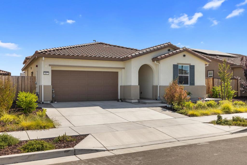Welcome to this charming 3-bedroom, 2-bathroom home located in the city of Lathrop. Perfectly designed with a functional layout, the home offers 1,412 square feet of living space. The kitchen seamlessly integrates with the family room, creating a welcoming hub for gatherings. Flooring throughout the house complements its warm ambiance, and a cozy fireplace adds to the charm during cooler months. Additional amenities include a central AC system and central forced-air heating, ensuring comfort year-round. The dining area is conveniently situated adjacent to the family room, providing a lovely space for meals and entertaining. A dedicated laundry area adds to the home's practical features. The property also includes a spacious 2-car garage. Situated on a lot of approximately 4,375 square feet, this home is part of the Manteca Unified School District. Enjoy all these features in a neighborhood that offers both conveniences and community.