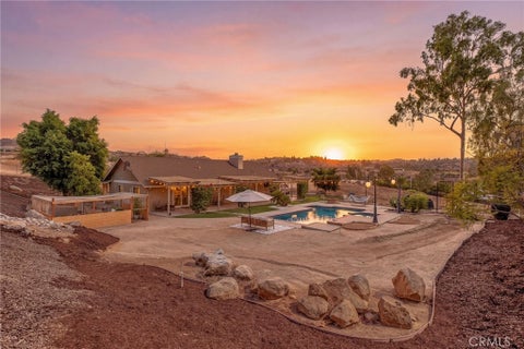 Photo of 8015 Gopher Gulch Road, Riverside, CA 92506 (MLS # IG26192759)