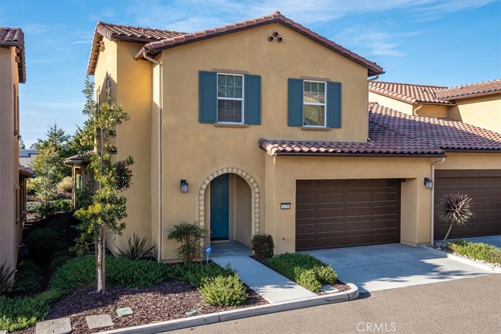 Enjoy luxurious townhome living with this Acacia, once the model home for this floor plan. Built in 2018, and offering 3 bedrooms, 2.5 baths, plus a loft, this 1814 sq. ft. home is brimming with designer extras. Inside, the open-concept floor plan is tied together with gorgeous tile flooring. The great room has a stone fireplace (pre-wired for TV) and lots of windows that bring in the natural light. A beautiful accent wall and 3-pendant light defines the dining space; and the kitchen has a large island, rich cabinetry, solid surface counters with tile/stone backsplash, GE Profile stainless appliances, including a gas cooktop, and direct access to the extended covered patio. Across the way, the master suite features a soothing driftwood accent wall, ceiling fan, and decorator window treatments. Modern grey/white tile flooring which extends to the shower sets off the master bath and enhances the spa-like feel. Plus, there’s dual sinks with a custom mirror, and walk-in closet. Also on the lower level is a half bath, laundry, and linen storage. Head upstairs to the spacious open loft, (which could be a den or office), 2 full bedrooms, each with a defining accent wall, and a full bath with tub/shower. Additionally, there’s a storage area for sporting goods, seasonal decor, etc. - helping to keep the 2-car garage tidy. This professionally decorated townhome is everything you could ever desire. Best of all, it’s located close to all the amenities Trilogy has to offer.
