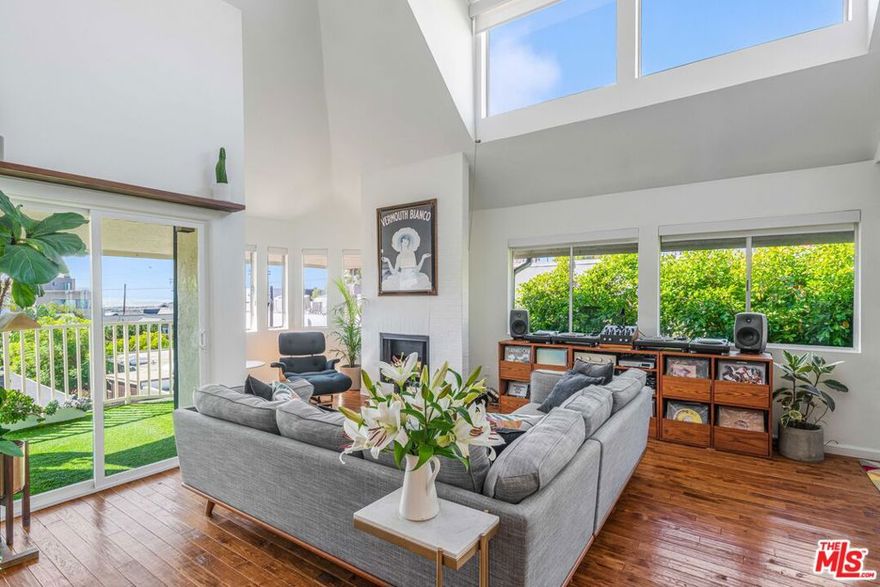 Experience the best of coastal living in this stunning 2-bedroom, 3-bath view condo with a spacious bonus den/office, ideally located just steps from the sand on a picturesque walk street on the coveted Marina Peninsula. Enjoy ocean views and breathtaking sunsets from multiple rooms, along with three private balconies-perfect for indoor-outdoor living (off the living room, primary suite, and office). The open-concept living area features soaring ceilings and flows effortlessly into a generous dining space and updated kitchen. Surrounded by windows, the home is filled with abundant natural light. The versatile loft offers the perfect space for a home office, den, or creative space. Additional highlights include two side-by-side parking spots in a secure garage, a large private storage unit, access to a shared yard- ideal for kids or pets to play, and exercise room of lobby. Nestled on the quiet end of the Peninsula, yet just a short stroll to the Ballona Lagoon, Venice Canals, Abbott Kinney and Venice's best shops and restaurants, this home is the perfect blend of tranquility and coastal convenience.
