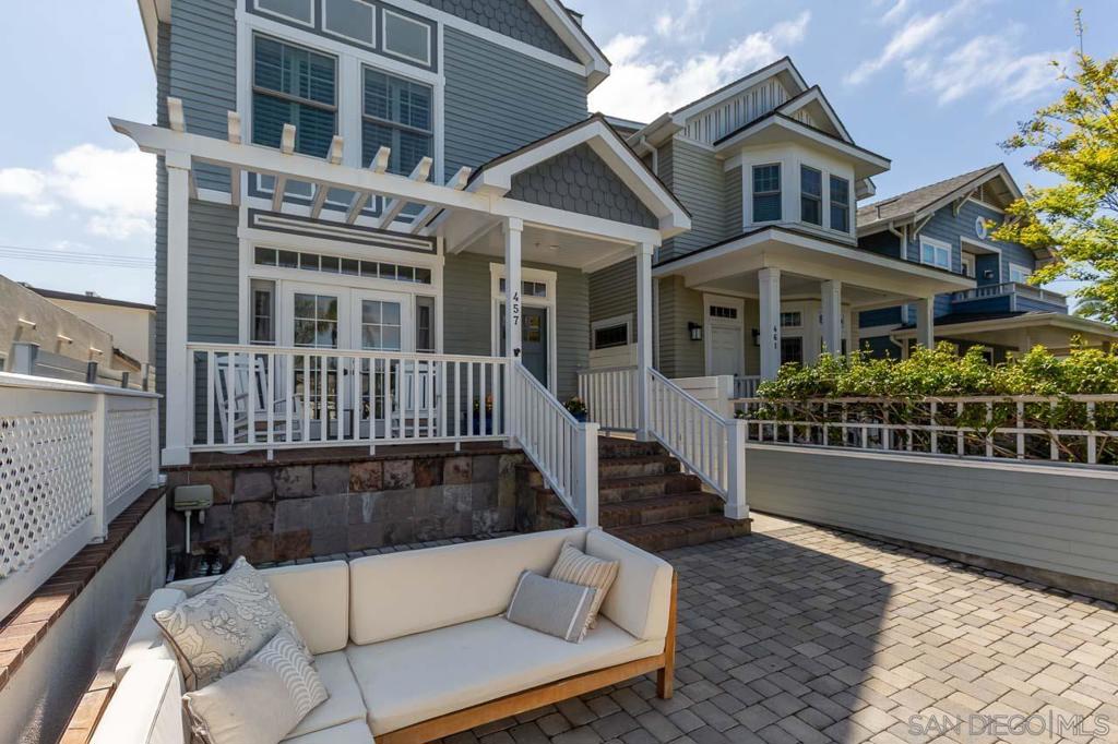 Welcome to this beautiful fully detached home offering the perfect blend of coastal charm and over 2,500 square feet of light-filled living space. This charming residence features 4 bedrooms, plus an optional fifth bedroom—perfect for an office or guest suite, along with 3 full bathrooms and two half bathrooms. The open layout and tasteful upgrades throughout are perfect for a family or vacation rental. The low maintenance front yard is equipped with a fire pit, elevated porch and French doors that open to the main living area. The kitchen, dining and living areas flow effortlessly ideal for entertaining or simply enjoying the Coronado breeze. The third floor deck offers unobstructed views of the San Diego skyline. You'll love the abundant storage, two-car tandem garage as well as its central location just two blocks to award winning Coronado public schools.