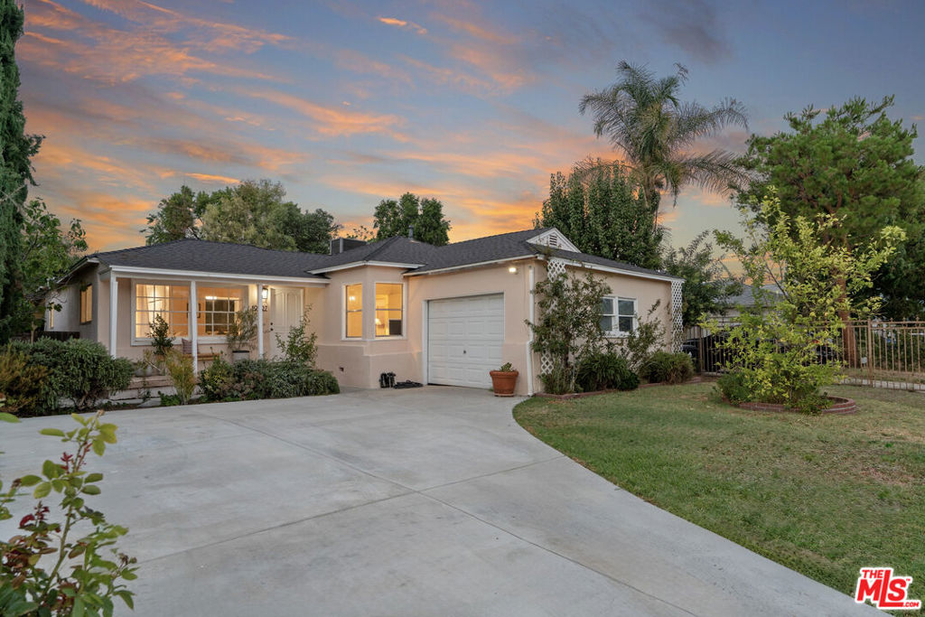 Welcome to this beautifully maintained home on a quiet Reseda street, surrounded by mature landscaping, citrus, and fig trees. A large grassy yard and peaceful covered patio just off the kitchen create the perfect setting for outdoor living and entertaining. Inside, the open floor plan features a newly renovated kitchen including new premium appliances with a spacious island seamlessly connecting to the family room, where a cozy fireplace adds warmth and charm. The home offers 3 bedrooms and 2 bathrooms, along with numerous upgrades completed in the last five years including roof, HVAC system, water heater, fencing, and more. Lovingly cared for and thoughtfully updated, this home is move-in ready and full of character. Close proximity to Pierce College, CSUN and freeway access. Don't miss the opportunity to call this private property your next home.