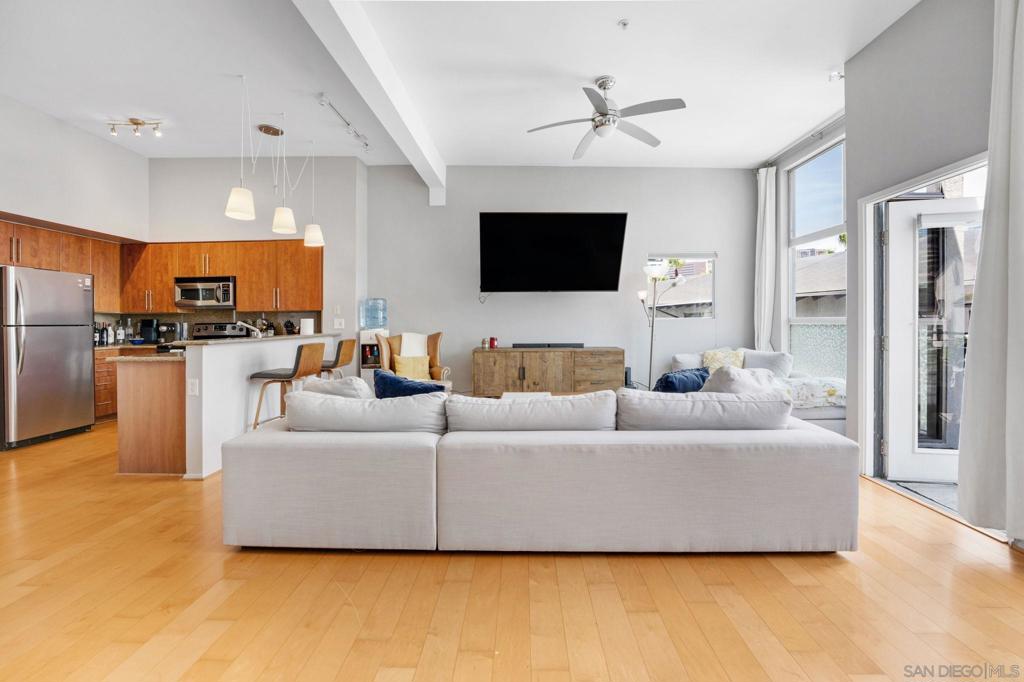 op-floor gem in the heart of the Marina District, right next door to the Children's Museum and a vibrant dog park. This bright and airy residence at Atria offers a peaceful, tree-lined courtyard view and windows on two sides, filling the home with natural light. Soaring ceilings add a spacious feel, while tasteful upgrades like hardwood floors, modern lighting, and a ceiling fan create a stylish, comfortable vibe. The open kitchen features stainless steel appliances and granite countertops, perfect for cooking or entertaining. Enjoy your morning coffee on the private balcony, and keep everything organized with a walk-in closet customized for maximum storage. Just steps from Downtown’s best restaurants, shops, and waterfront paths—urban living at its finest.