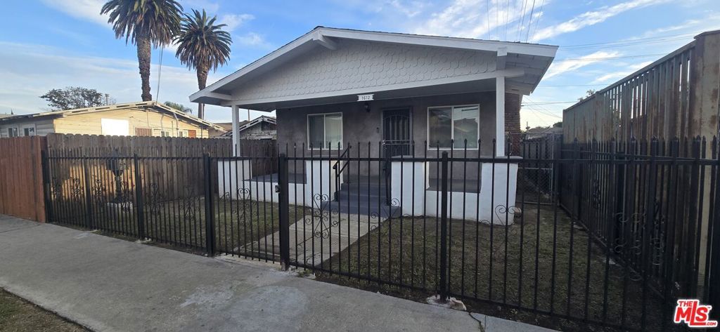 Photo of 1612 W 55th Street, Los Angeles, CA 90062 (MLS # 26651235)