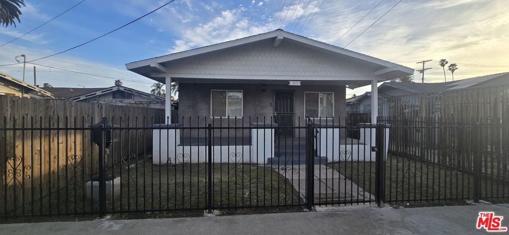 Photo of 1612 W 55th Street, Los Angeles, CA 90062 (MLS # 26651235)