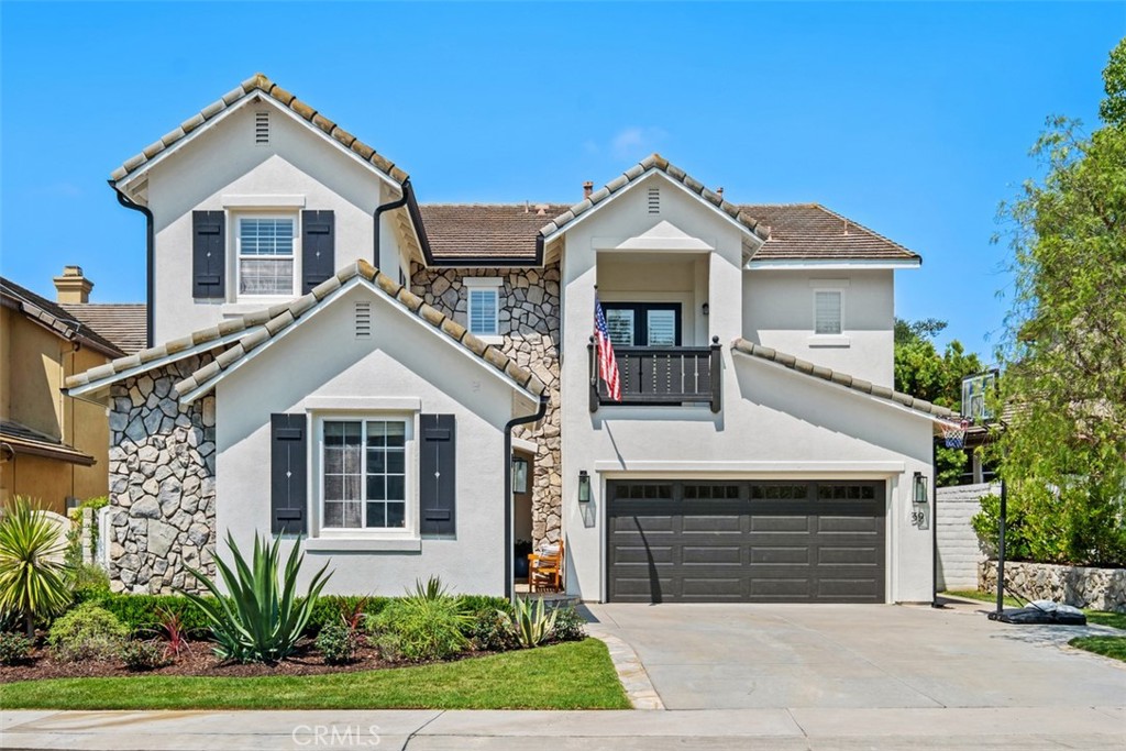 Located on a cul-de-sac street in the coveted Courante tract of guard-gated Coto de Caza, this home offers private and luxurious outdoor living surrounded by woods with no rear neighbors. Arrive to your double stall, 3-car garage with upgraded doors and a covered entry. Over 3,000 square feet of beautifully appointed living space features 5 bedrooms and 4 full bathrooms, with elegant wainscoting, moldings, high ceilings, and abundant natural light throughout. Entertain in formal dining and living areas with the first of three fireplaces. The gourmet kitchen features a custom remodel in 2022 with all-new appliances, island with bar seating, and an adjacent breakfast nook. Seamlessly move into the family room with a custom fireplace, built-ins, surround sound, and direct access to the outdoor living areas. The main level also includes a versatile guest bedroom with a full en suite bath and private entrance. Upstairs, the primary suite features a private fireplace, vaulted ceiling, and tranquil tree views. The primary bath includes a double vanity, soaking tub, walk-in shower, and spacious walk-in closet. Three additional upstairs bedrooms feature updated lighting and plantation shutters, with two sharing a Jack-and-Jill bath, and an upstairs loft with built-in desk provides a perfect office or homework space. Outside, enjoy multiple seating areas all surrounded by gardens and mature trees. Grill and gather at the built-in BBQ featuring a sink, refrigerator, and ice storage. Additional improvements include a full plumbing repipe by Repipe1, luxury wood vinyl floors from Bentley flooring, exterior lighting, custom front door, Jack-and-Jill bath tile, lower bath fixtures, family room mantel and built-ins, designer bedroom lighting from Pottery Barn and West Elm, and new bathroom lighting including recessed lighting in the primary bath. Most recently in 2025, the property received new rear window screens, new carpet, new flooring in the primary bath, and a new backyard gate providing direct trail access. All in a fabulous location of Coto de Caza, where amenities include horse trails, clubhouse, gym, pool, spa, tennis, and two championship golf courses designed by Robert Trent Jones Jr. at the renowned Coto de Caza Golf & Racquet Club. Top-rated Capistrano Unified schools, parks, and diverse shopping and dining are only minutes away. A rare opportunity to own your private retreat within one of Orange County's most prestigious communities.