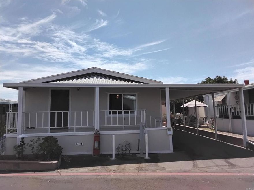 Beautiful, cozy, and with a great floorplan. Close to EVERYTHING.  Home is in move in condition and has been updated a couple of years ago. Very quiet and clean park. There is a small storage building in the back by a nice private patio. Central Heat & A/C. Vaulted ceilings throughout this lovely home.