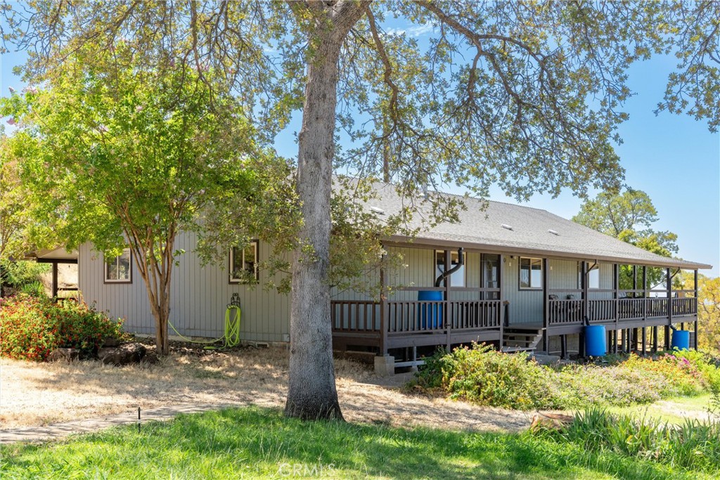Discover peaceful country living with this 3-bedroom, 2-bath home offering 1,653 sq. ft. of comfort and charm on 6.5 acres overlooking the valley. From sunrise to sunset, take in sweeping panoramic views that stretch all the way to the Coastal Mountain Range, painting the sky in vibrant colors each evening. Inside, a beautiful kitchen showcases a warm butcher block counter, complemented by durable and stylish LVP flooring throughout the home, creating the perfect space for cooking, gathering, and entertaining. The property also boasts 20 owned solar panels to keep energy costs low, and a spacious 4-car shop ideal for vehicles, equipment, or a dream workshop. A strong well and South Feather irrigation water make it easy to maintain lush gardens, a small orchard, or space for livestock. Whether you’re relaxing on the porch watching the sun dip behind the mountains or envisioning your own hobby farm, this property delivers unmatched views, privacy, and potential—all just minutes from town.