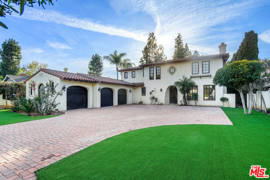 Experience the enduring allure of Mediterranean living in Encino's coveted Amestoy Estates. Tucked behind gates on a generous 20,000 sq ft lot, this timeless residence blends privacy, elegance, and endless potential. The property includes expired but easily renewable plans for a 1,200 sqft ADU, offering added flexibility and value. A charming cobblestone motor court leads you to a home rich with character, featuring classic hardwood floors, sun-drenched rooms, and tasteful architectural touches throughout. The chef's kitchen is a true centerpiece, complete with an oversized island, high-end appliances, and a butler's pantry perfect for entertaining or everyday living. The luxurious primary suite boasts a private balcony, spa-inspired bath, and spacious closets, while the outdoors invites relaxation with mature landscaping, a sparkling pool, covered patio, and a cozy outdoor fireplace. Just minutes from Ventura Boulevard's shops, restaurants, and top-rated schools, this exceptional estate is a rare opportunity to personalize and enjoy the best of classic Encino living.