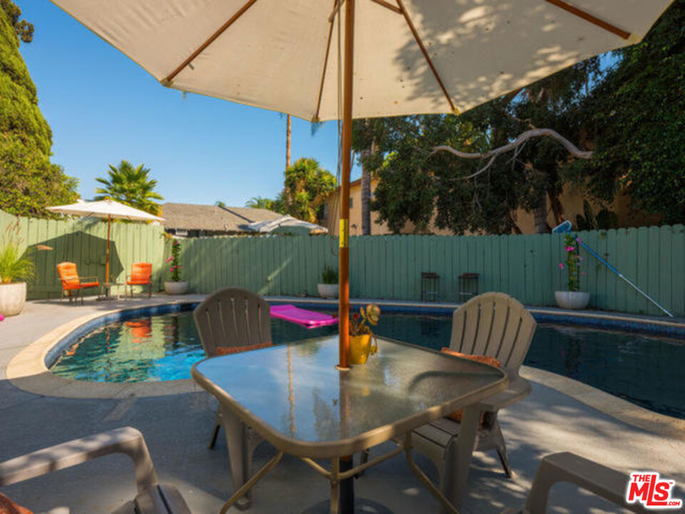 Enjoy the West Hollywood lifestyle in your private large sparkling pool on this gated home with 4 bedrooms and 3 bathrooms including a separate guest house, and a grassy backyard! It's great for entertaining open floor plan includes living, dining, family room all with gorgeous hardwood floors throughout, and modern fireplace. Newly remodeled kitchen with granite countertop w/ backsplash, stainless steel appliances and custom-made cabinetry opens up the dining area, making it a perfect entertaining space. The master suite has a direct access to a large veranda that overlooks the large pool area. Guest House is detached with full bathroom. Long gated driveway with remote control access for two cars. Lot is almost 6300 square ft. Enjoy the West Hollywood Lifestyle!
