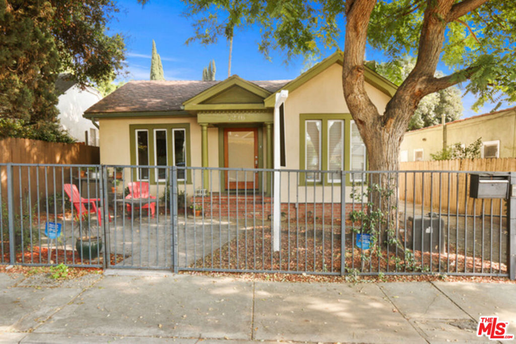 West Hollywood gated home with 4 bedrooms and 3 bathrooms including a separate guest house, with sparkling large pool and grassy backyard! It's great for entertaining open floor plan includes Living, Dining, Family Room all with gorgeous hardwood floors, and modern fireplace. Newly remodeled kitchen with granite countertop w/ backsplash, stainless steel appliances and custom-made cabinetry opens up the dining area, making it a perfect entertaining space. The master suite has a direct access to a large veranda that overlooks the large pool area. Guest House is detached with bathroom. Long gated driveway with remote control access for two cars. Lot is almost 6300 square ft. Enjoy the West Hollywood Lifestyle!
