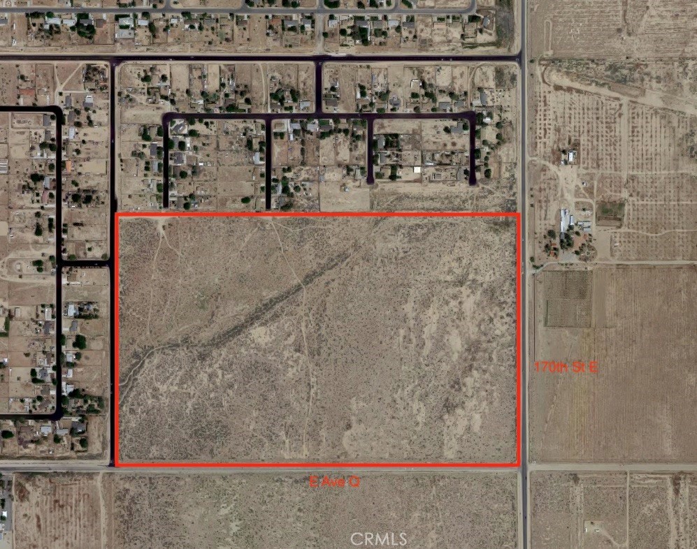Exceptional development site in Lake LA, on the popular "Palmdale side" of the area. At just under 100 acres (100 acres gross), this rectangular infill parcel is ripe with opportunity, and is one of the few large, undivided land parcels within the area. Attractive seller financing available. Owner will consider a long-term land loan. The parcel has paved streets on 3 sides, with one of them being 170th St E, which is the main north-south thoroughfare through Lake LA. It has a hard corner at 170th and Ave Q, which is another main street. The north side of the parcel is abutted by an existing housing tract, with 4 feeder streets that can be easily extended onto this property, allowing a developer to "complete" the housing tract to the north of the parcel, which is essentially in an unfinished state at the moment. Potential mobile home park development site. There may even be commercial potential with this property, owing to the frontage on 170th street and the hard corner of 170th/Q. Some or all of the lot may be re-zoned to commercial, and it could make a great location for a gas station or shopping center. Water, electricity, and gas services are all available. There are also nice views of the buttes to the west and mountains to the south. Home values are strong in Lake LA, with existing homes in the area selling in the $400,000+ range, and new homes are likely to sell in the $500,000+ range. This property sold for $1,240,000 in 2008, when home prices in this area were roughly half of what they are currently. Possibilities for a housing developer include subdividing the property to mirror the existing street layout to the north and selling off the individual parcels, building a housing tract of new construction homes and selling them for $500,000+, or even building a tract of ''Build to Rent'' homes with ADU's to double the density. At $9,500 per acre, this property is a great price for a nearly 100 acre infill parcel with main street frontage, and that is nestled within existing housing tracts, as opposed to a raw desert parcel with no street frontage or utilities. Buildable infill parcels of this nature are rarely available, and a large contiguous parcel on the "Palmdale side" of Lake LA presents a tremendous opportunity.