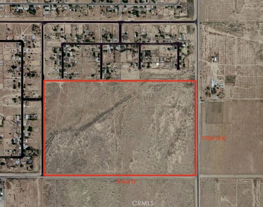 Exceptional development site in Lake LA, on the popular "Palmdale side" of the area. At just under 100 acres (100 acres gross), this rectangular infill parcel is ripe with opportunity, and is one of the few large, undivided land parcels within the area. Attractive seller financing available. Owner will consider a long-term land loan. The parcel has paved streets on 3 sides, with one of them being 170th St E, which is the main north-south thoroughfare through Lake LA. It has a hard corner at 170th and Ave Q, which is another main street. The north side of the parcel is abutted by an existing housing tract, with 4 feeder streets that can be easily extended onto this property, allowing a developer to "complete" the housing tract to the north of the parcel, which is essentially in an unfinished state at the moment. Potential mobile home park development site. There may even be commercial potential with this property, owing to the frontage on 170th street and the hard corner of 170th/Q. Some or all of the lot may be re-zoned to commercial, and it could make a great location for a gas station or shopping center. Water, electricity, and gas services are all available. There are also nice views of the buttes to the west and mountains to the south. Home values are strong in Lake LA, with existing homes in the area selling in the $400,000+ range, and new homes are likely to sell in the $500,000+ range. This property sold for $1,240,000 in 2008, when home prices in this area were roughly half of what they are currently. Possibilities for a housing developer include subdividing the property to mirror the existing street layout to the north and selling off the individual parcels, building a housing tract of new construction homes and selling them for $500,000+, or even building a tract of ''Build to Rent'' homes with ADU's to double the density. At $9,500 per acre, this property is a great price for a nearly 100 acre infill parcel with main street frontage, and that is nestled within existing housing tracts, as opposed to a raw desert parcel with no street frontage or utilities. Buildable infill parcels of this nature are rarely available, and a large contiguous parcel on the "Palmdale side" of Lake LA presents a tremendous opportunity.