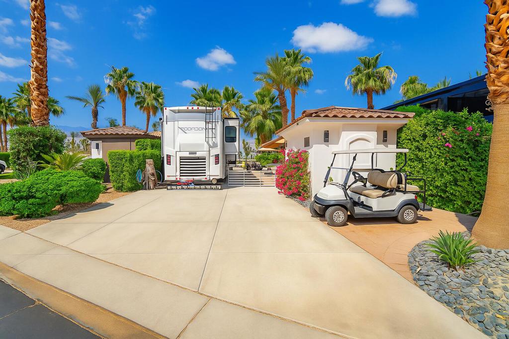 Lot 339 at Motorcoach Country Club in Indio, California, is a rare waterfront opportunity featuring a private boat dock, upgraded casita, and luxury outdoor living space--all set within one of the Coachella Valley's most prestigious Class A motorcoach resorts. This premium lot offers a turnkey experience with a fully equipped BBQ island, fire table, and lounge area perfect for entertaining or relaxing by the water. The detached casita includes a full bathroom, new Samsung SMART washer and dryer, and ample storage, making it ideal for guests or extended stays. Privacy landscaping, gated access, and a professionally installed invisible pet fence enhance both security and serenity. As a resident, you'll enjoy exclusive access to Motorcoach Country Club's world-class amenities, including a renovated clubhouse with fine dining, scenic boating canals, three resort-style pools, a 9-hole golf course, pickleball and tennis courts, and a state-of-the-art fitness center. Lot 339 is ideal for buyers seeking a luxury motorcoach lifestyle in Southern California's sought-after Indio resort community. MCC accommodates Class A motorhomes (30'-45'). Per zoning, on-site structures are not dwellings and overnight stays are not permitted. Annual Food & Beverage minimum: $2,080.