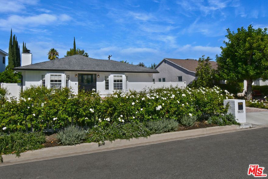 Located South of the Boulevard in prime Encino, this turnkey home with a detached ADU offers resort-style living with luxurious upgrades, modern functionality, and seamless indoor-outdoor flow. Inside the main house, an open-concept layout welcomes you with a chef's kitchen featuring stainless steel appliances, a breakfast bar, and views of the landscaped front yard. The serene primary suite includes vaulted ceilings, a spa-inspired ensuite bath, and French doors that open directly to the resort-style backyard. Every detail has been thoughtfully curated - from hardwood floors and custom bathrooms to an outdoor sound system, EV charging, and a top-tier security system. The fenced-in front yard showcases natural grass, vibrant landscaping, and a charming white picket fence - perfect for pets and play. The backyard is an entertainer's dream, featuring a large heated, covered deck, fully equipped outdoor kitchen with built-in BBQ, a cozy fire pit and a sparkling pool surrounded by mature greenery. Just beyond, a 400 sq. ft. ADU offers a full kitchen, pool bath, and flexible living space - ideal for guests, a home office, gym, or poolside entertaining. Located just minutes from El Caballero Country Club and the shops and restaurants of Ventura Boulevard, this exceptional Encino home blends timeless California charm with modern comfort in one of the Valley's most sought-after neighborhoods.