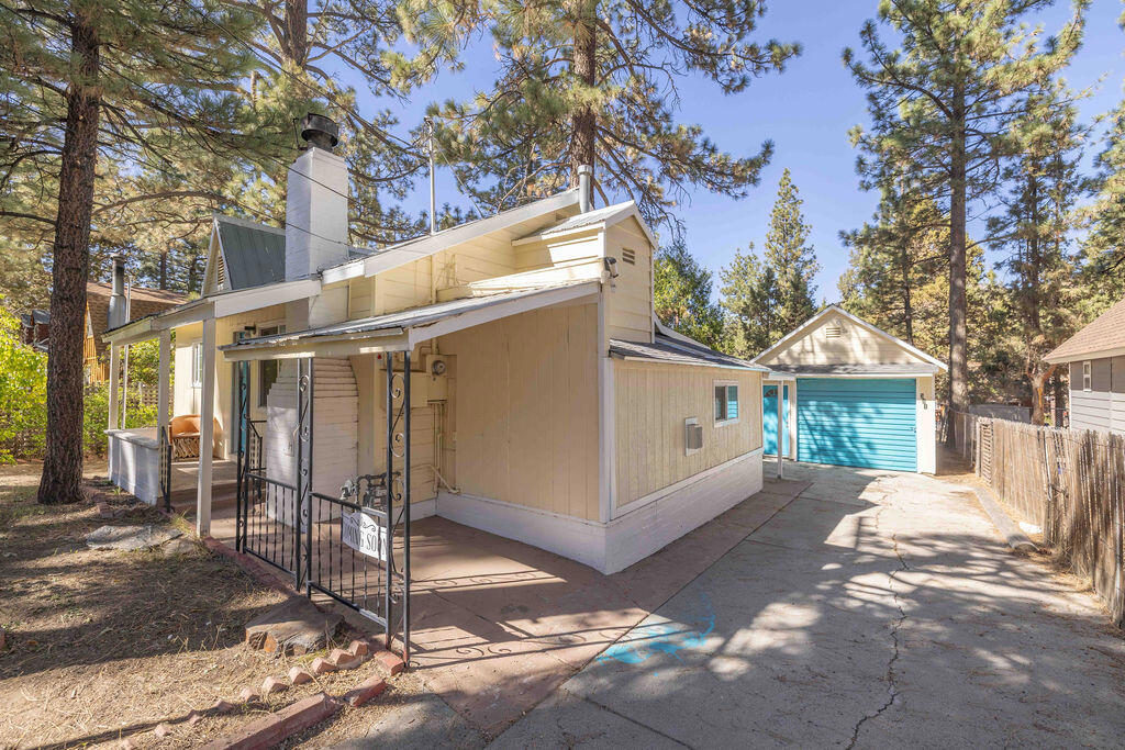This newly renovated home is move in ready and offers a low-maintenance lifestyle in a desirable location. The 705 sq ft interior features two bedrooms, one is a primary with the full bathroom attached and a second bedroom with 1/2 bath. This cozy home is where you want to spend your time here in Big Bear. Washer and dryer room is just off the kitchen and has room to work. The property offers a fenced yard and a spacious deck, and spacious for outdoor relaxation, BBQ and/or entertaining guests. The 5000 sq ft lot is fully fenced so if you have any fur babies or little ones that need to stay protected in the yard, with lots of space to run around, play games, plant a garden or whatever you would like, this one is for you. A One car garage is at the back of the property with a storage area included in it. Room to store your toys during the off season. Close to Community market, and resteraunts and a few shops that you might want to look into. This home would make a wonderful starter home, or a great weekend retreat from the hussel and bussel of city life, or an investment. Come take a look and see for yourself. Make this one yours before someone else does!