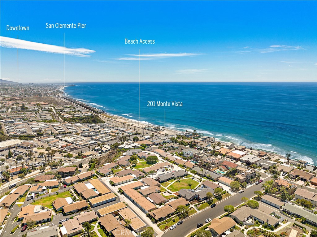 Live the refined, beach-close lifestyle you’ve imagined at this impeccably reimagined single-level ranch home in San Clemente. Nestled within Bay Cliff Village—a coveted 55+ enclave of just 28 residences—this two-bedroom, two-bath retreat lives like a detached home, sharing only one wall. A curated blend of timeless character and modern elegance defines the property, where used brick, board-and-batten siding, and meticulous landscaping echo its 1962 heritage, while every interior detail reflects an inspired, contemporary sensibility.
The approximately 1,266-square-foot floor plan unfolds with effortless flow, introduced by a custom front door that opens to a sunlit living room anchored by a bespoke fireplace. The dining area extends seamlessly to a private patio through Milgard sliding doors, while the chef’s kitchen delights with Shaker cabinetry, quartz counters, a full tile backsplash, a pantry, French-door refrigerator, and a suite of Bosch stainless-steel appliances including a five-burner cooktop, oven, microwave, and dishwasher. The guest bath features a quartz countertop and frameless glass shower enclosure, while the primary suite offers a generous closet and an ensuite bath with granite countertops, a walk-in shower, and slate tile surrounds.
Thoughtful upgrades abound, including a whole-home water filtration system, tankless water heater, newly installed Hunter Douglas window coverings, and energy-efficient Milgard windows. Floors of woodgrain porcelain tile complement custom paint, Shaker-style interior doors, recessed lighting, and a laundry closet with full-size washer and dryer. Outdoor living shines with a Trex deck and irrigated landscaping, complemented by direct, private access from the patio to a separate one-car garage—one of only four in the community with this rare advantage. The garage includes built-in storage, and both the home and garage were re-roofed in 2024. A recently sleeved sewer line adds peace of mind, ensuring the property is as functional as it is beautifully maintained. Home can be purchased fully furnished at an additional cost.
Bay Cliff Village is designed for connection, with meandering pathways, lush central park spaces, and a welcoming clubhouse for neighborhood gatherings. Moments from the sand, Shorecliffs Golf Club, San Gorgonio Park, and local shopping, this home blends everyday ease with coastal sophistication.