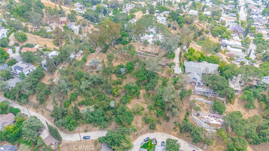 Rare opportunity to own six contiguous parcels in the hills of Highland Park. Ideal for investors, developers, or end-users looking to build multiple homes or a private compound (buyer to verify). Peaceful hillside setting with natural surroundings and potential city or mountain views. Conveniently located near York Blvd, Figueroa St, and major freeways, offering quick access to shops, restaurants, and neighboring communities like Eagle Rock and South Pasadena. Buyer to conduct their own due diligence regarding zoning, utilities, and development potential.