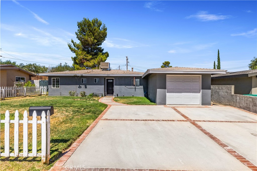 Charming home in desirable West Palmdale location! This property offers 3 bedrooms, 1.5 bathrooms, plus a possible Home Office/Home Gym, providing plenty of space for your needs. Designed with energy efficiency in mind, the home features a newer roof, dual-pane windows, and an owned solar panel system, helping reduce utility costs year-round. The garage has been converted, creating a versatile space ideal for a home office, gym, or workshop, and can easily be converted back if needed. Situated on a generous ¼ acre lot, there's ample room for outdoor living, gardening, or future additions. The exterior has been freshly painted, giving the home a clean, well-maintained look. Located near award-winning schools, parks, shopping, and with easy freeway access, this property is full of potential and ready for your personal touch.