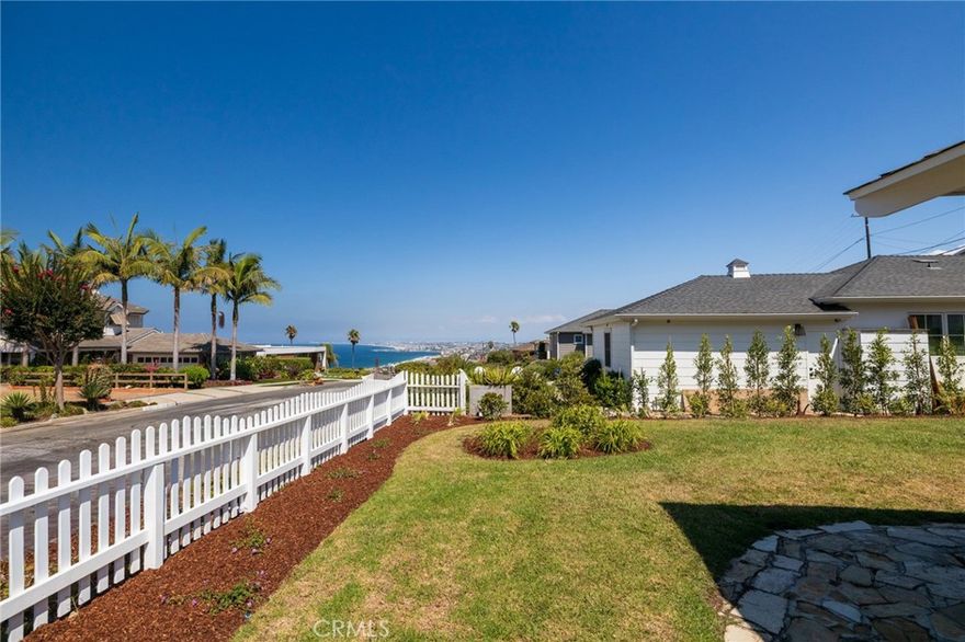 Nestled in the coveted upper Hollywood Riviera, this charming beach cottage offers ocean breezes, and Queen's Necklace views from the front yard and inviting front porch. Stroll to the beach, PV trails, and Riviera Village shops. Take advantage of top-rated Torrance schools, and friendly beach community living in a quiet neighborhood. This home strikes the rare balance of original Hollywood Riviera charm and thoughtful updates: the perfect combination for a coastal-lifestyle dream. Boasting gleaming hardwood oak floors, a crackling fireplace, sunroom, private yard with deck, fresh paint inside and out, lush new landscape, a quintessential white picket fence, and so much more. this 4 bedroom, 2 bath home is perfect for a family or remote workers; there are endless options. And the price includes gardening, and monthly housekeeping!

Imagine sunsets from your front porch, ocean breezes in every room, and seamless indoor–outdoor flow for entertaining—or peaceful mornings with a view. Don't miss out on this gem.