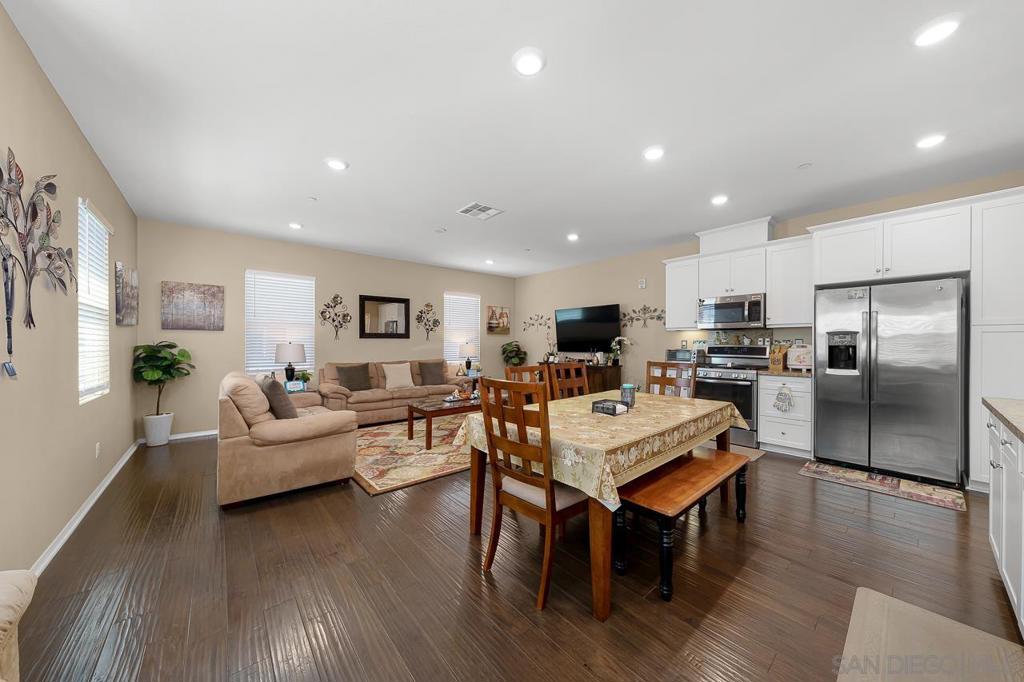 Beautifully maintained end-unit townhome in the Lake Pointe community of Eastlake Vistas. Offering 3 bedrooms, 2 bathrooms, and 1,437 sq. ft. of living space, this home features a direct-access 2-car garage and functional two-level layout. The main-floor primary suite includes patio access for added privacy, while upstairs showcases an open-concept design with a bright kitchen, dining area, and spacious living room. Two additional bedrooms, a full bath, and a laundry room with full-size washer/dryer complete the second level. Enjoy the Eastlake Vistas lifestyle with access to scenic trails, Otay Lakes, Mountain Hawk Park, and the Chula Vista Elite Training Center. Conveniently located near the Enagic Golf Club, Otay Ranch Mall, top-rated schools, dining, and freeway access. A fantastic opportunity in one of Chula Vista’s most desirable neighborhoods.