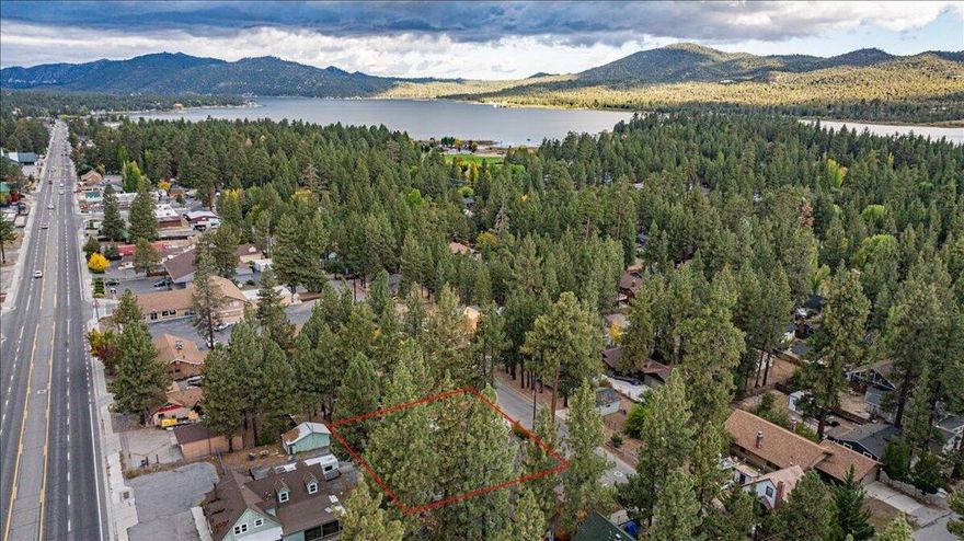 Prime commercial opportunity in the heart of Big Bear Lake! Unlock the potential of this expansive 11,120 sq ft level paved lot, ideally situated just one street off Big Bear Blvd. Zoned C2, this versatile property offers endless possibilities for your next business venture--retail, office, hospitality, or mixed-use development. Enjoy unbeatable proximity to top attractions: less than a mile to Snow Summit and just about a mile to the Village, making this a high-visibility location year-round. Whether you're building from the ground up or investing in future growth, this central gem is a rare find in Big Bear's thriving commercial landscape. Home next door at 41591 Tahoe is also for sale and is also zoned C2, but has been used as a residential full-time rental. Imagine the possibilities with both!