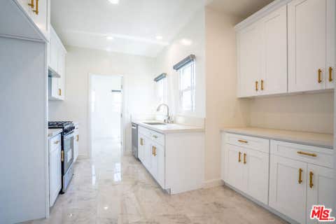 Photo of 1226 Keniston Avenue, Los Angeles, CA 90019 (MLS # 26862777)