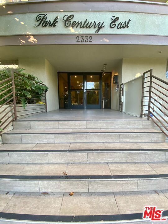 West facing, Sun lit spacious condo with Soaring ceilings in Rancho Park! Enter this light and bright unit with gorgeous engineered hardwood floors and soaring ceilings. Make this home your own with a convertible loft that can be utilized as a bedroom with a large walk-in closet and full bath, but also can be used as an office and/or den and features a stunning Fieldstone fireplace. Wonderful entertainer's space with open kitchen to dining area leading to a grand living room with Floor to ceiling windows complete with Plantation Shutters that access the West facing balcony. This lovely unit is located directly off of the elevator and is on the top floor of the building with ample storage! A sparkling pool is easily accessed on the ground floor and parking is side by side in the community garage. With a 77 walk score and directly next to 20th Century Fox Studios. Adjacent to Rancho Park Golf Course, this location cannot be beat.
