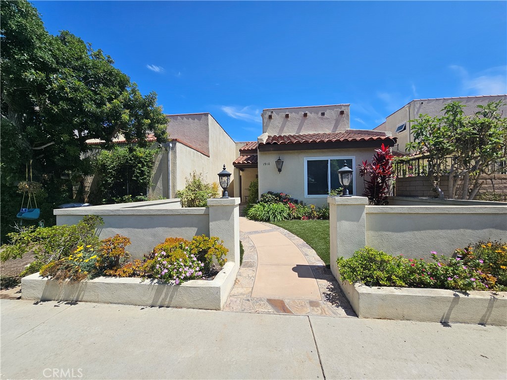 This lovely home is available for immediate occupancy! As you approach the main door, you are welcomed by a beautiful front yard and inviting side porch. The inside has a spacious and open floorplan with high ceilings. The kitchen boasts designer stainless steel appliances with built-in range, wine cooler, granite counters, a center island, farm sink, 6 burner gas cooktop, pots & pans drawer and recessed lighting. From the large kitchen which opens to dining room, glass sliding doors lead out to a side patio perfect for big gatherings and outdoor entertainment. The main floor bedroom offers vaulted ceiling where bright and natural light seeps through. Two master bedrooms upstairs that have en-suite bathrooms which include Jacuzzi tubs, separate showers, dual sinks and spacious closets. Both upstairs bedrooms have access to the spacious rooftop deck which serves as the perfect space to entertain or relax. This property's location offers the best of both worlds: a bit secluded from Downtown HB, but close enough to the beach, parks, Main St. and activities.