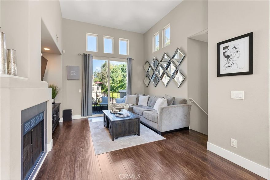 This is the home you have been waiting for!

This truly exceptional property is a stunning, remodeled 2-bedroom, 2-bathroom home in the highly desirable Corte Melina community, located in the heart of Rancho Santa Margarita. This tri-level home features an open floor plan, spacious vaulted ceilings, and an abundance of windows that fill the home with natural light. It has undergone an extensive and meticulous renovation, with attention to every detail, making it truly spectacular.

As you step inside, you'll be greeted by a beautiful entry that leads to the spacious main-level living area, featuring a fireplace and warm wood floors. Sliding doors open to a tranquil and generous patio, perfect for unwinding or relaxing with a book. The dining room, adorned with a beautiful designer chandelier, is ideal for entertaining and family gatherings.

The remodeled chef's kitchen is a culinary dream, boasting gorgeous quartz countertops, a breakfast bar, under-mount lighting, stainless steel appliances, and stunning tile floors. The generously sized main-level bedroom includes a large closet and direct balcony access. The main-level bathroom has been renovated with a new tub, vanity, fixtures, lighting, cabinets, and a quartz countertop, adding a touch of modern elegance.

The private primary suite, a true retreat, is conveniently located on the top level, complete with a ceiling fan and dual mirrored closets. Its spa-like In-suite bathroom features twin sinks, a soaking bathtub with custom tile work, quartz countertops, and designer lighting.

A lower-level laundry area with built-in storage is conveniently located near a one-of-a-kind bonus area that is sure to impress. The attached single-car garage offers additional storage space and an EV charger plug.

Residents of this community enjoy resort-style amenities, including a swimming pool, spa and fitness center. The property's convenient location provides easy access to award-winning schools, shops, dining, and nearby parks, hiking/biking trails, RSM Lake, Beach Club Lagoon, and various entertainment options.

This home offers an exceptional lifestyle of comfort, convenience, and elegance. The new homeowner will truly appreciate this centrally located, meticulously cared-for, highly upgraded, and move-in ready home.

I invite you to schedule your private showing today.