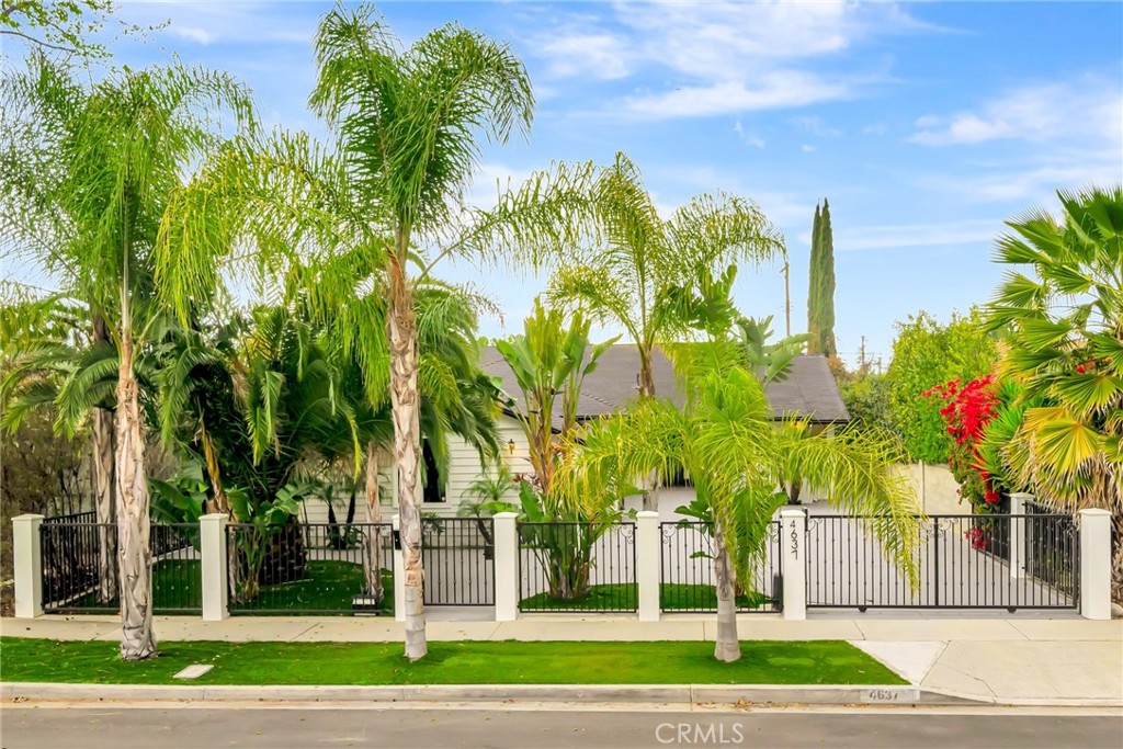 Beautifully remodeled, gated single-family home in the heart of Sherman Oaks! Nestled on a tranquil cul-de-sac, this elegant property offers the perfect combination of modern luxury and serene privacy. Step inside to discover wide plank hardwood floors that flow seamlessly throughout the open-concept living spaces, creating a warm and inviting atmosphere. The spacious living room is perfect for entertaining. A step down family room opens opens to a private yard. The primary suite is a true retreat, offering generous space and a spa-like ambiance. The luxurious primary bathroom features a freestanding soaking tub, dual vanities, and a spacious walk-in shower, creating a serene escape at the end of the day. Both other bathrooms were remodeled with modern designer touches. All bedrooms are well sized. Front bedroom has a separate entrance making it a perfect option for an in-home office or a guest bedroom. Enjoy the outdoor living space in your private backyard, perfect for relaxing or hosting friends and family. The gated entrance ensures privacy and security, making this home feel like a secluded sanctuary while still being conveniently located near the best that Sherman Oaks has to offer. Property is equipped with a back-up generator yo insure that lights always shine bright in this home. Don’t miss out on this exceptional opportunity to own a turn-key home in one of the most sought-after family oriented neighborhoods in Los Angeles.