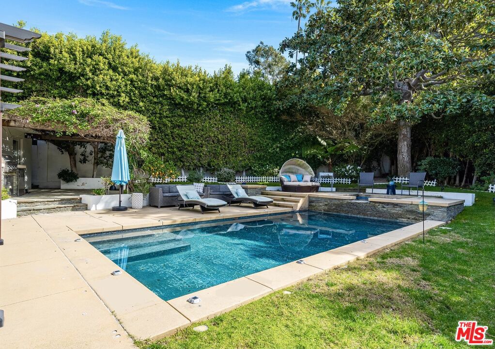 Stunning newly renovated contemporary one-story gem. This 4 Bedroom, 4 bath features the ultimate rare offering located on a coveted corner lot in the most desirable Beverlywood location. Welcome entry with dramatic tall ceilings and an open floor plan gives the house a breezy airy feeling of modern grace and beauty. Renovated with the finest materials and appointments. Featuring chef's kitchen complete with the highest quality, Wolf, Bosch, and Dacor appliances, island range, two sinks and vast cooking spaces. The master suite is a true sanctuary with view of the backyard. Three additional bedrooms and baths. No need to take a vacation with a backyard as luxuriously relaxing and elegantly glamour as this. The large lot features private resort experience, dazzling heated waterfall swimming pool with Jacuzzi, built in barbecue, complete with private gazebo lounging area and variety of space to socialize and dine. Truly a must see property!