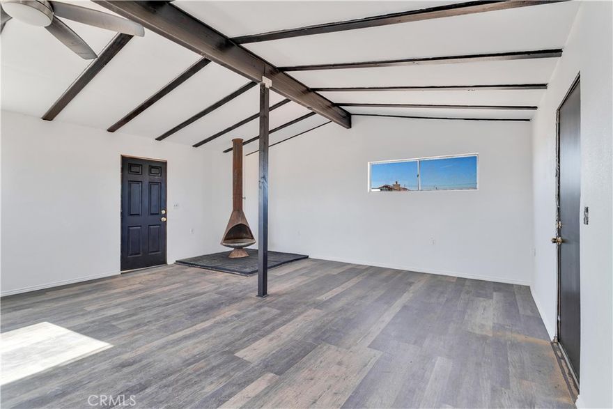 Joshua Tree back entrance location - Ultimate Wonder Valley private Rec Cabin with simple luxury in the High Desert on five expansive acres. Professionally renovated - this spectacular tiny home features an airy living and dining space with beamed ceiling with custom framed doors and windows, Morso WB fireplace and a generous living area. Brand new double lined stucco on the outside and fully insulated detailed craftsman finished work on the inside.   NEW ROOF just installed and 20 foot beamed ceiling at the peak.    Upgraded Electric Panel. The Power is on to this house and previously had hauled water.  Bathroom and Kitchen framed will need to be finalized.  Area is booming with Artists, New Restaurants, and Hip People of all ages. 

Wonder Valley is less than 15 minutes from the entrance to Joshua Tree National Park! As you approach the property, 360 degree panoramic views surround you, stretching from JTNP to the south to Mojave Trails National Monument to the North. The charming facade with its stonework accents welcomes you to explore further w- 5 private acres, you have plenty of room to expand your dreams. There are fewer and fewer of these unique Rec Cabins that haven’t be bought up by big land companies  - don't miss out on your chance to own your personalized hi-desert hideaway.  Move in ready. Pictures say it all.  Offered $79,900 Firm CASH.
