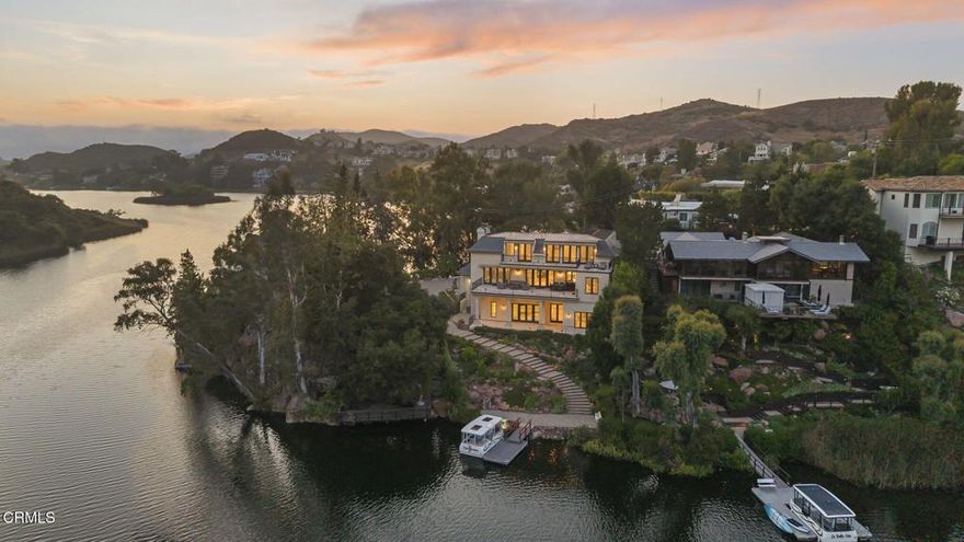 Welcome to Chateau Sherwood, an iconic waterfront estate nestled in the prestigious Lake Sherwood community. This 7,782 square foot masterpiece features 5 spacious bedrooms and 4 1/2 luxurious bathrooms and offers a rare blend of timeless elegance and modern comfort. The home is a showcase of Italian and French artisan craftsmanship, from the custom designed chandeliers and sconces hand made in Venice, Italy utilizing Murano glass, 14k gold and Swarovski Crystals. Appreciate the captivating hand-crafted bespoke furniture also custom crafted in Italy exclusively for the residence.  French design elements incorporate antique limestone reclaimed from Opera Bastille in Pairs to the 17th century marble fireplace mantel imported from the Chateau in France.  Perfect for entertaining, the home features a private boat dock, a 500-bottle climate-controlled wine cellar, a rare in-home, 3-story elevator, 3 zone heating/cooling systems, a chefs kitchen featuring the hand crafted La Cornue range and expansive spaces designed for both intimate gatherings and lavish events. Set within a community known for its world-class estates, this is more than a home - it's a statement.Experience the peace and serenity of lakefront living at its finest at 2112 Trentham Road, Lake Sherwood, California.