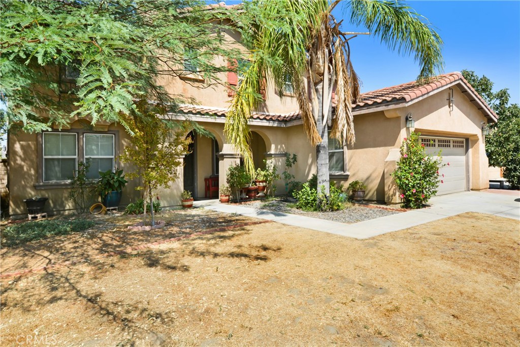 Attractive 5 bedroom 3.5 bath home in a popular west-end area of Hemet. Over 3000 sq ft of living space and a park sized yard. Everything about this home is L A R G E! Covered arched entry adds a spanish flair to the street appearance. The neutral colors throughout this home allow your design touches to dictate the ambience of your new home. The family room has a recessed wall that will allow unobtrusive placement of your entertainment center and will accommodate sectional furniture. The kitchen has a breakfast bar that will easily accommodate seating for 4 and is also part of the family room. There an informal dining space off the kitchen as well as formal dining and pantry. Upstairs is a loft with adequate space for the whole family to enjoy with a computer center. Save some steps with the laundry room on the same level as the bedrooms. The master bath has a separate shower and tub. Covered full length patio with a enclosed dog area. Oh, and a dog park nearby for your furry friend. There are two bedrooms downstairs and three upstairs. Perfect for accommodating a large or extended family. Ranco Viejo Middle School is at the end of the block and Tahquitz High is down Cawston Ave. Minutes from shopping and ez access to highways for out of town commuters.