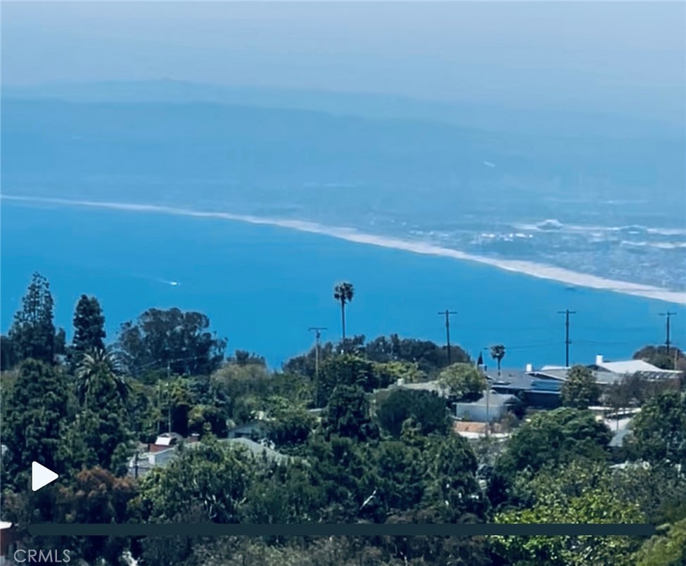 Beautiful OCEAN View - Miles of City and Mountain VIEWS...Spectacular Views at night! Spacious 2 bedrooms with walk- closets, 2 bathrooms (ocean view from main bathroom). Stainless steel appliances including Refrigerator, in-door laundry room with Washer and Dryer included. Livingroom with beautiful fireplace and sliding doors leading to balcony has city and ocean views. 3 Balconies all with ocean and city views. Tesla Charger connected no need to wait around to charge, private entry basement garage include 2 parking spaces. Only 10 units in the complex - making it family oriented community with gated entrance and pool. Easy access to Parks and shopping!!