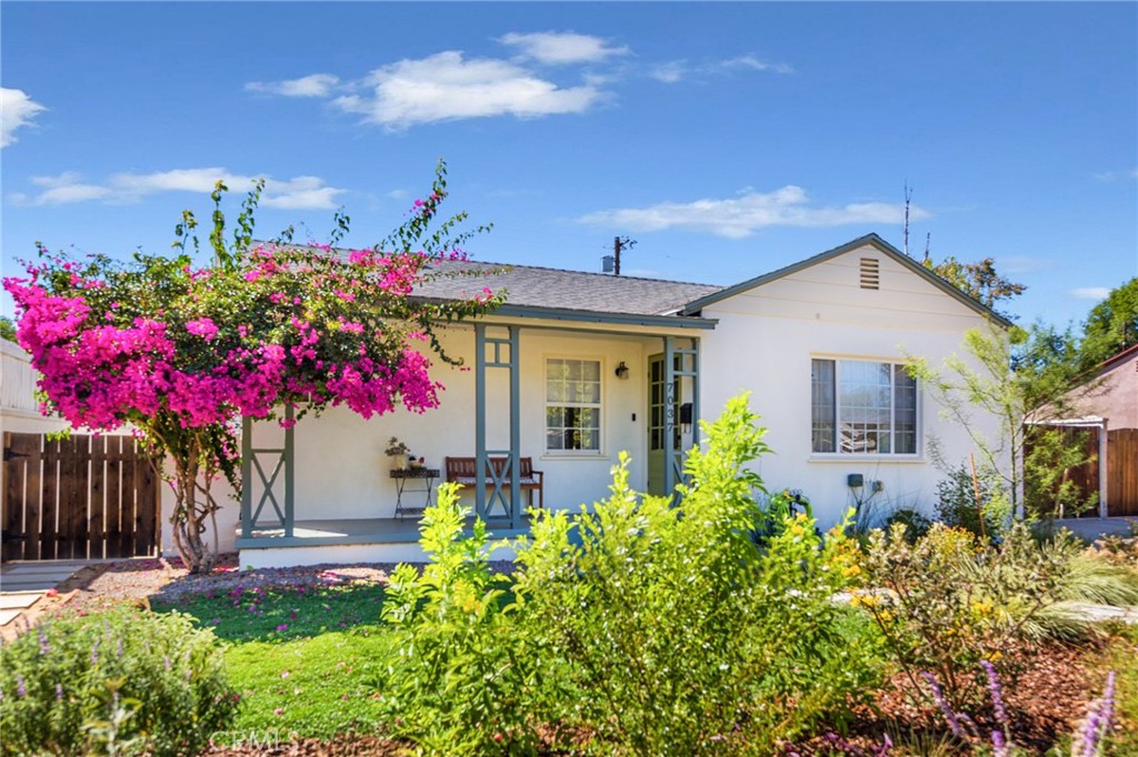This mid-century classic combines timeless charm & character with beautiful contemporary upgrades & details. The home has been meticulously maintained and shows true pride of ownership throughout. From the inviting curb appeal with fresh drought tolerant landscaping that will
explode with color each spring to the warm, light-filled living spaces inside. There is a spacious living room & dining area that leads to the updated kitchen with granite counters & newer premium stove. The primary bedroom comes complete with beautiful tile floors, new custom closets and a private entrance leading to the enchanting back yard. This house has two completely renovated bathrooms each designed with style, high quality fixtures and love. There is newer tasteful laminate flooring in the living room, kitchen, laundry room and bedrooms that creates a sense of flow and simplicity throughout. There is also newer interior & exterior paint. Your family will love hanging out in the warm, cozy den with large open sliding doors that looks out to the entertainer’s covered patio and backyard. Stepping out to the spacious backyard with lush, mature landscape you will feel you are in a serene garden oasis. The backyard also offers two storage sheds. Additional amenities include copper plumbing, recessed lighting, updated dual pane windows & a home EV charging station. Situated in an excellent Reseda neighborhood adjacent to Lake Balboa and just two blocks to Gault Street Elementary School.