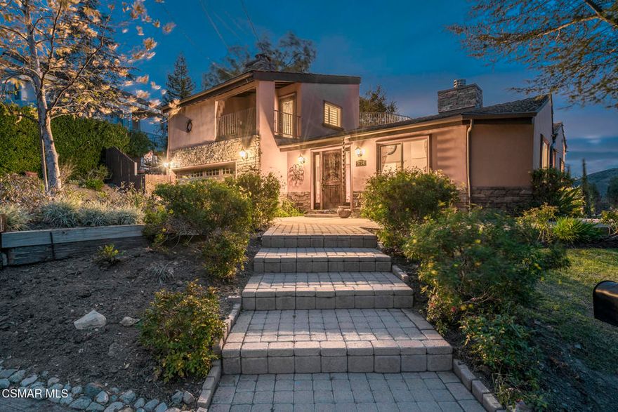 Escape to a private retreat tucked away on nearly an acre of enchanting, view-filled landscape. This custom home seamlessly blends indoor and outdoor living, offering panoramic, long-range vistas of the Santa Monica Mountains from almost every window and deck on the property. Whether you're seeking ultimate privacy, multi-generational living, or flexible spaces for all your passions, this residence delivers. A thoughtfully designed floor plan features 4 bedrooms & 4 baths, 3 of which are en-suite--perfect for families, guests, or creating dedicated work and creative zones. The main level hosts a tranquil primary suite with its own secluded balcony.  Upstairs, a second luxurious primary suite awaits, offering a spacious bathroom, cozy fireplace, and private rooftop deck where you can take in a canopy of stars. On the lower floor, find an oversized studio--with its own entrance, kitchen, full bathroom, fireplace, and sweeping mountain views--makes an ideal guest retreat, creative studio, or entertainment lounge (4th bedroom).  The main floor has an additional bedroom & hall bath in addition to the primary suite. At the center of the home is a chef's kitchen, featuring stainless steel appliances, a breakfast bar, and a warm fireplace, fostering memorable gatherings. Step outside to a scenic terrace, tailor-made for al fresco dining, sunset cocktails, and evening conversations under golden skies. Horse and animal lovers will delight in the dedicated lower property--accessed by a second driveway--and housing two high-quality horse stalls and a sizable turnout, complete with hay and tack storage. Sunny and shaded areas make this haven ideal for nurturing horses, minis, goats, or other animals--or easily convert the space for a home gym, workshop, or expansive garden. Additional highlights include four full bathrooms, two kitchens, four fireplaces, five decks, and an inviting rustic brick patio. Two driveways provide ample parking, including an RV space. One of the driveways is gated and leads down to the horse area. Located in the sought-after equestrian community of Old Agoura, you'll enjoy peaceful country living just minutes from city amenities, top-rated Las Virgenes schools, private academies, and a stunning 4,000-acre National Park with world-class hiking, riding, and cycling trails. Whether you're hosting lively gatherings on the patio, relaxing by a crackling fire, or simply savoring the serenity and privacy of your own home, this rare property invites you--and your guests--to linger, unwind, and truly feel at home.