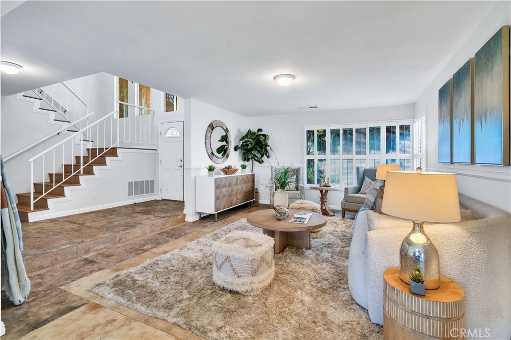 Welcome to this beautifully updated home in the heart of Torrance, featuring an upgraded kitchen and bathrooms, fresh interior paint, and brand-new laminate flooring for a bright, modern feel. The kitchen showcases white cabinetry, granite countertops, and stainless steel appliances, creating both style and functionality. An inviting wet bar adds the perfect touch for entertaining guests or enjoying quiet evenings at home. The primary suite features high ceilings and a private bathroom, offering a spacious, relaxing retreat. Additional bedrooms are generously sized and filled with natural light, while the bathrooms are appointed with thoughtful finishes. Ideally located near shops, restaurants, and freeways, this home offers both convenience and comfort. With its smart layout, quality upgrades, and prime location, it’s ready for you to move in and make it your own.