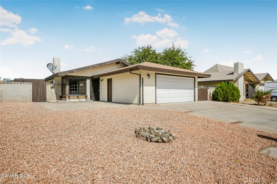 This beautifully renovated 3-bedroom, 2-bath home offers modern comfort, functionality, and space inside and out. Freshly painted inside and out, it welcomes you with a bright, contemporary feel throughout. The fully remodeled kitchen features all-new cabinets, countertops, stainless steel appliances, sink, faucet, and garbage disposal—perfect for everyday cooking and entertaining in the dine-in kitchen. The home offers two spacious living areas, ideal for relaxing or hosting guests. Brand new vinyl plank flooring runs throughout the entire property, complemented by new light and plumbing fixtures for a polished finish. The master suite includes a cozy sitting area, a private entrance to the backyard, and a beautifully updated bathroom with a new vanity, sink, faucet, toilet, and a walk-in tile shower. The guest bath is equally upgraded with a new vanity, top, sink, faucet, toilet, and a tub/shower combo with custom tile surround. Outside, the large yard is a standout feature—fully enclosed by block walls for privacy, with plenty of concrete areas perfect for entertaining, parking, or recreation. There's also a storage shed and a long gated driveway with true RV access and concrete parking behind the fence—an excellent setup for vehicles, trailers, or toys. The front yard features clean, easy-care rock landscaping and new landscape touches for great curb appeal. Complete with central heat and air, a 2-car garage, and indoor laundry, this move-in ready home is perfectly located close to schools, shopping, parks, and more. A rare offering in an excellent location—come see this property today before it's gone!
