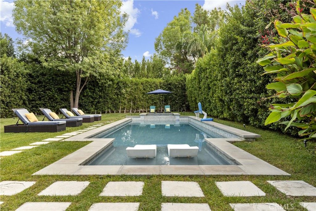 Photo of 22900 Hatteras, Woodland Hills, CA 91367 (MLS # BB25257463)