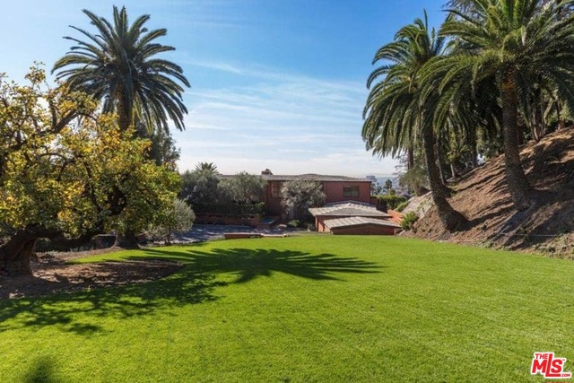 New Price! Incredible value for this Hollywood Hills Estate on 1.8 usable acres with city views. Iconic 1940's Moderne by C. Raimond Johnson AIAFirst time on the market in 25 years. this rare and unique Mansion was built in 1941 with a vision of design rarely seen today. Gated community affords seclusion, yet moments from major destinations of the city. Large motor court, 2 story entry with unique curved wood and glass staircase. Walls of glass looking out to city views and lush landscaped grounds with resort sized pooll A true one of a kind opportunity!
