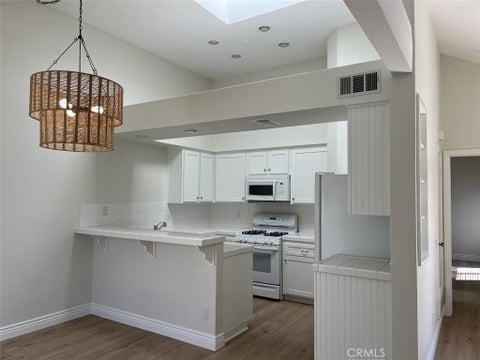 Photo of 4822 Tiara Drive #203, Huntington Beach, CA 92649 (MLS # OC26231087)