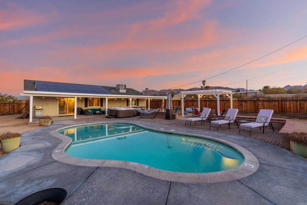 Welcome to Your Desert Oasis!Discover paradise in this beautifully maintained, newer home nestled in the highly desirable Indian Cove neighborhood. This 3-bedroom, 2-bath gem offers the perfect blend of comfort and luxury featuring a sparkling saltwater pool, relaxing jacuzzi, and a private fenced backyard designed for serenity and entertaining. Enjoy sun-filled days under the covered patio or unwind beneath the elegant gazebo while taking in stunning desert views. Inside, the home boasts a modern chef’s kitchen with granite countertops and stainless steel appliances, sleek tile flooring, and central air & heat for year-round comfort. The finished garage adds extra functionality, and the home’s location just minutes from the base, offers convenience without sacrificing peace and privacy. This is more than a home, it's your personal retreat in the desert. Come experience it for yourself, your clients will be amazed!