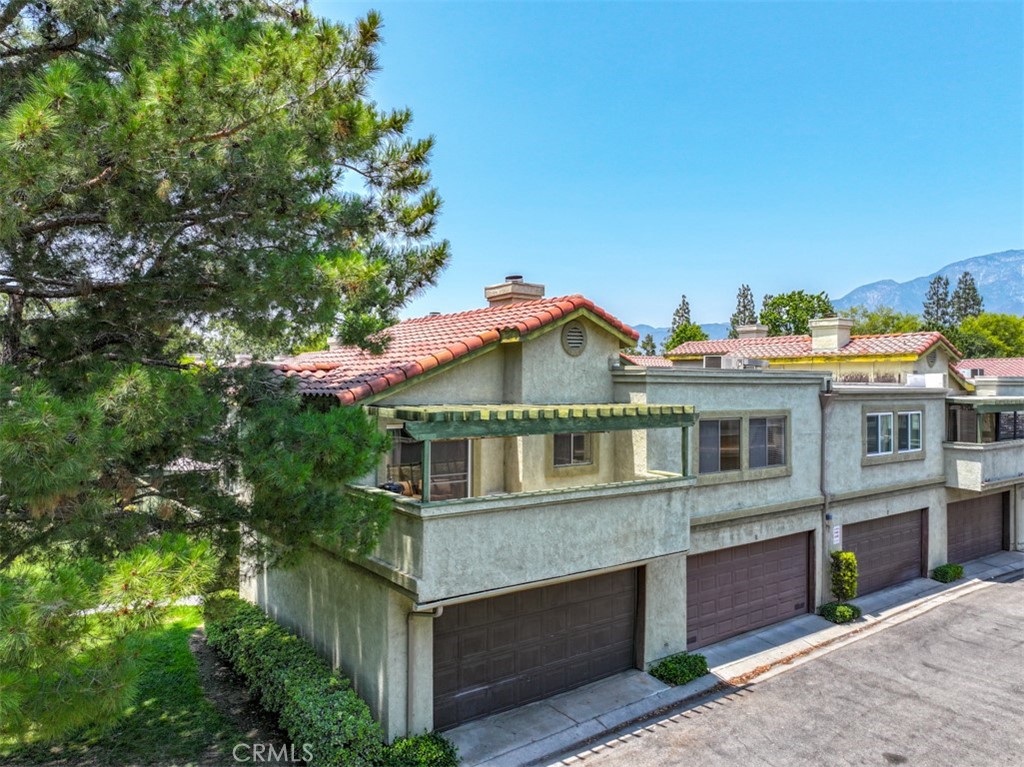 FABULOUS MEADWOOD VILLAGE END UNIT. Fall in love with this fabulous end unit located in one of the most prime locations within the community. Enjoy views of the greenbelt and the tree tops just outside of your living room/main living space and located across a greenbelt from the pool and spa area. Enjoy tennis courts, playground area, and is guarded - security that drives through the community. The unit itself has multiple upgrades - soaring ceilings, granite counter tops in the kitchen, and stainless appliances. Both bathrooms have been updated with newer vanities and primary bath with custom countertops and custom sink. This unit is all on 1 floor, no one above you and no one below you. Your living space is all on the second level above your attached garage and your neighbor's garage. Laundry is located in the attached two car garage. HOA dues include water, sewer, trash and security. This one is an absolute MUST SEE!