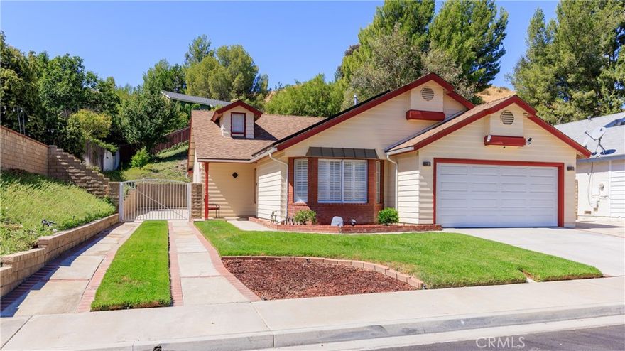 Welcome to this beautifully maintained single-story home offering 3 bedrooms, 2 bathrooms, and 1,758 sq. ft., a 39' x 9' gated RV parking pad, Solar panels that are OWNED, and a Generac whole-house generator for backup power. Inside, the home showcases tile flooring throughout the main living areas with carpet in the bedrooms. The formal living room, formal dining room, and expanded family room provide plenty of space for gatherings. The updated kitchen is a true centerpiece, featuring granite counters, a breakfast bar, a stylish tile backsplash, recessed lighting, ample cabinetry, and a pantry—all with seamless flow into the family room. The expanded primary bedroom suite offers a, walk-in closet, and  expanded retreat with generous space/shelving.The garage is designed with functionality in mind, equipped with 220V power, overhead storage, and its own electric lift system for easy access to stored items. Outdoors, enjoy a beautifully landscaped backyard with a custom-built patio cover, and awning that serves as a perfect BBQ area.This home truly has it all—upgrades, energy-smart features, and thoughtful design—all in a desirable single-story layout.