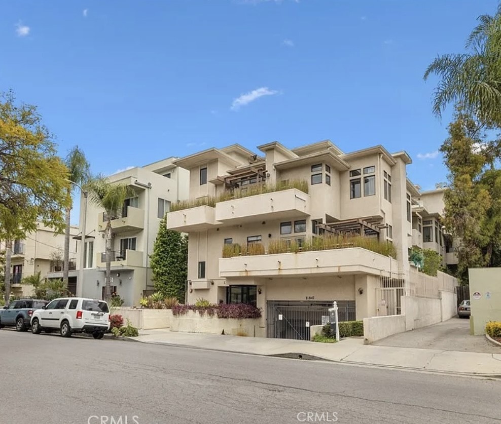 Nestled within one of Studio City’s prime neighborhoods, this luxurious 2-bedroom condo with 1601 square feet was entirely remodeled in 2022 with the best finishes in one of the most open floor plans. Step inside to discover wide-plank floors, LED lighting, and designer finishes throughout with 12” vaulted ceilings with plenty of bright natural light amidst private and tranquil green surroundings. The large living and dining rooms blend, creating the ultimate feeling of a ‘Grand Room’ with a modern fireplace and private balcony- perfect for entertaining. The spacious gourmet kitchen features professional-grade appointments, including Thermador appliances, Quartz countertops, white shaker cabinetry, stainless-steel inlay sink, and Bedrosian tile backsplash. A private alcove just off the kitchen boasts a storage area and a full-sized washer and dryer area for laundry. The large primary bedroom features a large walk-in closet with a custom California Closet cabinetry system for wardrobe, shoes, storage, and a private patio with beautiful morning and afternoon light. The primary bathroom has a free-standing tub, a large built-in vanity with storage, a double Pullman sink, and top-to-bottom Bedrosian tile finishes. The secondary bedroom is a spacious ensuite with a private, designer-appointed bathroom and ample closet. The gated building features an elevator, underground parking, including two reserved parking spots with EV charging possible and guest spots. Also, the rooftop deck features stunning views across Laurel Canyon and Universal Studios. Turn-key and ready… A rare gem in one of the best buildings in Studio City! With a Walkscore of 88, this condo is located around the corner from Ventura Blvd’s famed Sushi Row, Laurel Tavern, Yala Coffee, Joan’s on Third, and Studio City Farmer’s Market (Sundays). You’ll find Trader Joe’s, CVS, Starbucks, Salt & Straw, Barnes & Noble, Planet Fitness, and Alfred Coffee within close distance. Fryman Canyon is less than half a mile away for weekend hikes, and Runyan Canyon is just over Laurel Canyon.