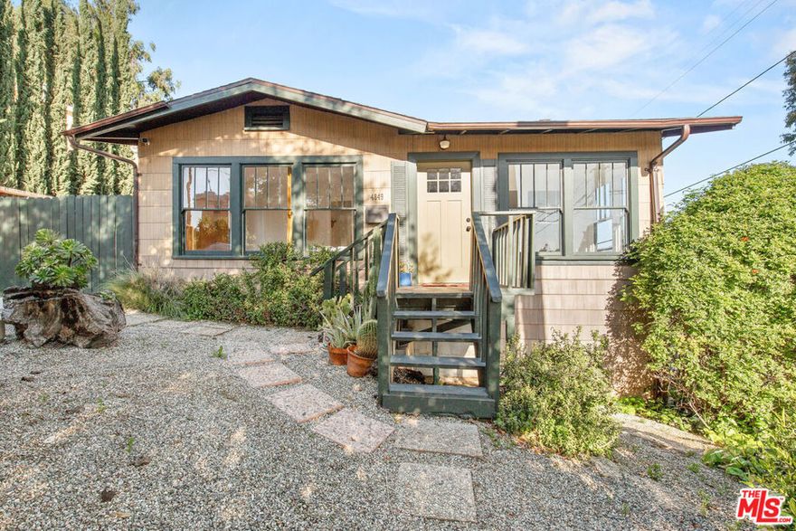 Perfectly situated on a tranquil hillside corner lot amongst gorgeous, lush trees and greenery, you are automatically going to fall in love. This enchanting Mount Washington Craftsman California Bungalow feels like a private retreat while centrally located around all the best that Northeast LA has to offer. You are welcomed to a sun-splashed foyer that leads to an expansive living/ dining area with white-oak hardwood floors, original brick decorative fireplace and picturesque mountain views through beautifully refurbished double-hung windows. Adjacent to the dining, the most charming galley-style kitchen awaits with warm elements, stainless-steel appliances, ample storage, and the cutest breakfast nook where your eyes just gaze into the stunning corner views. You'll awake to the morning sun from the two generous-sized rooms on the main floor, one corner with windows galore and the other with an ensuite bath with a clawfoot tub. Moroccan tile exudes style in the full hallway bath. Sizable laundry room with side-by-side Samsung front loaders brings you a dreamy backyard oasis perfectly laid out with a multi-tiered wood deck that fills the entire space, truly an entertainer's delight! Enjoy al fresco brunch/ dinner parties, hosting BBQs and enjoying smores around the fire-pit, you'll never want to leave home. Plant your favorite garnishes in the plantar boxes throughout and a 1-car garage for additional storage or an art/ hobby space. There is an entire lower level that could be used as a 3rd bedroom, work-from-home office/ studio space with modern built-in custom desk and shelving or have a home gym you've always wanted. Located within Mt. Washington Elementary School lines and just minutes from dining, shopping, multiple parks (walking distance to Cleland Park) it's the perfect home for those who enjoy both the city living and the nature's calm serenity. This is California living at its best.